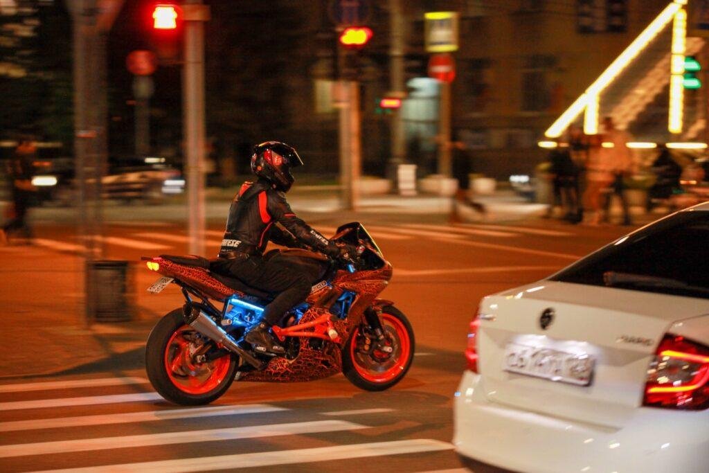 a person riding a motorcycle on the street