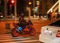 a person riding a motorcycle on the street